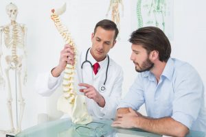 Derby Chiropractor explaining a spine